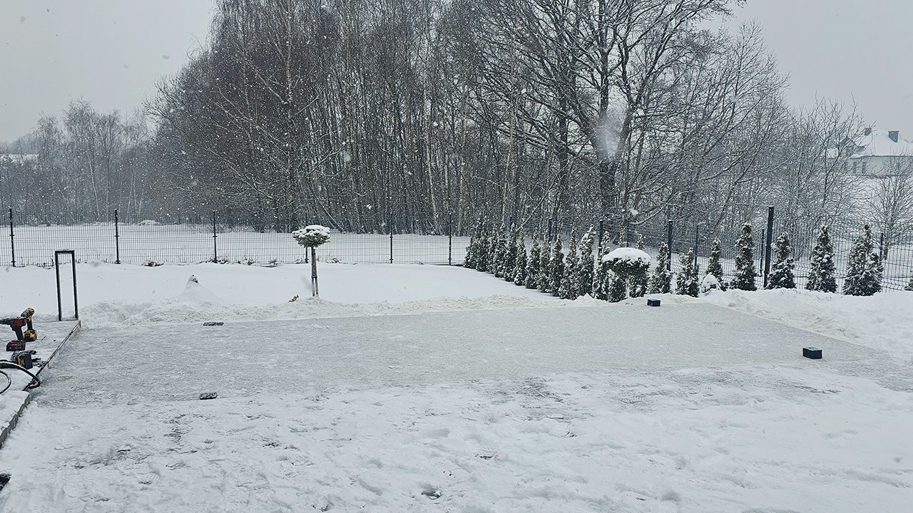 Luxury garden sauna foundation preparation showing leveled concrete slab ready for installation